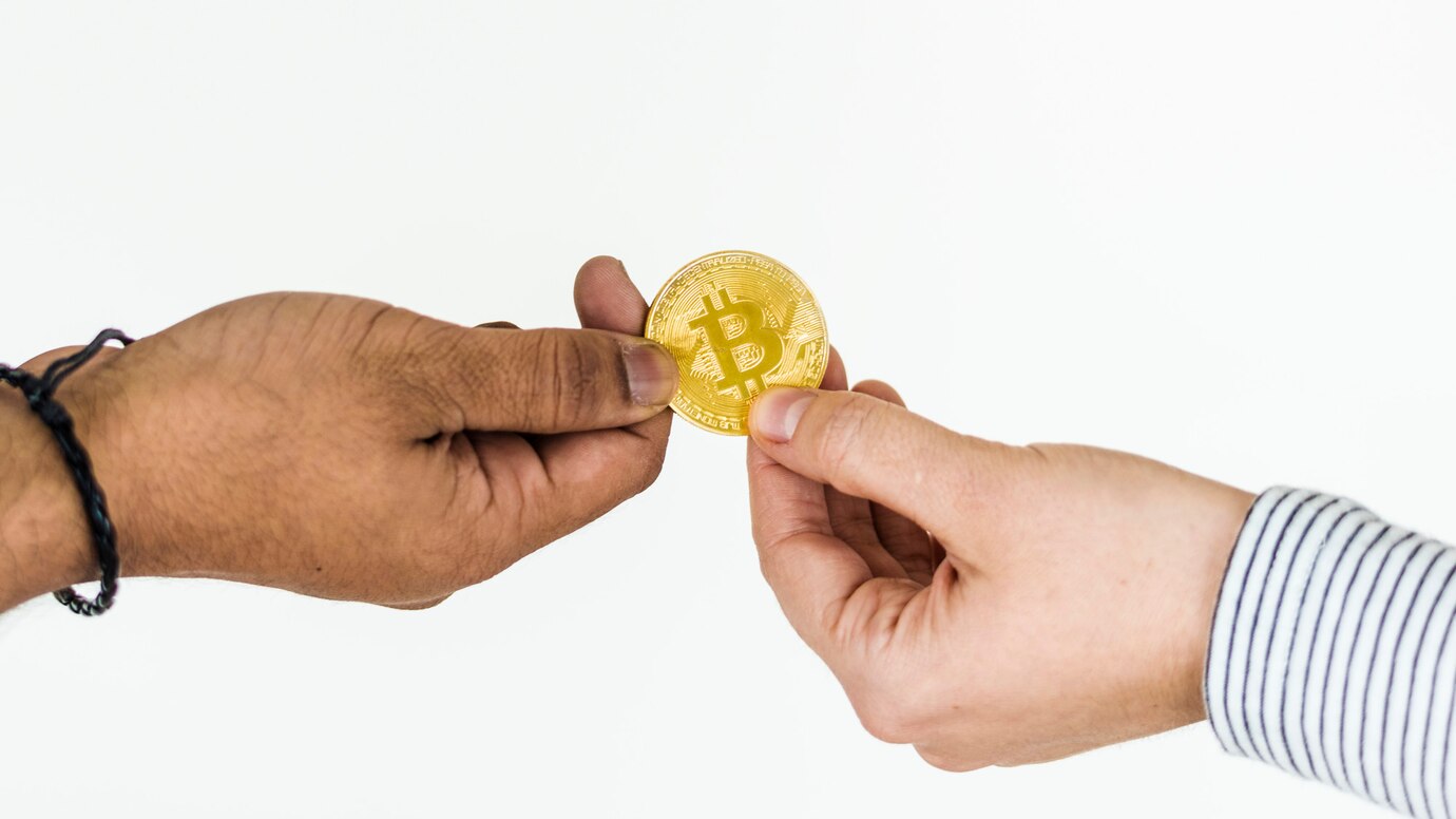 closeup-exchanging-bitcoin-isolated-white